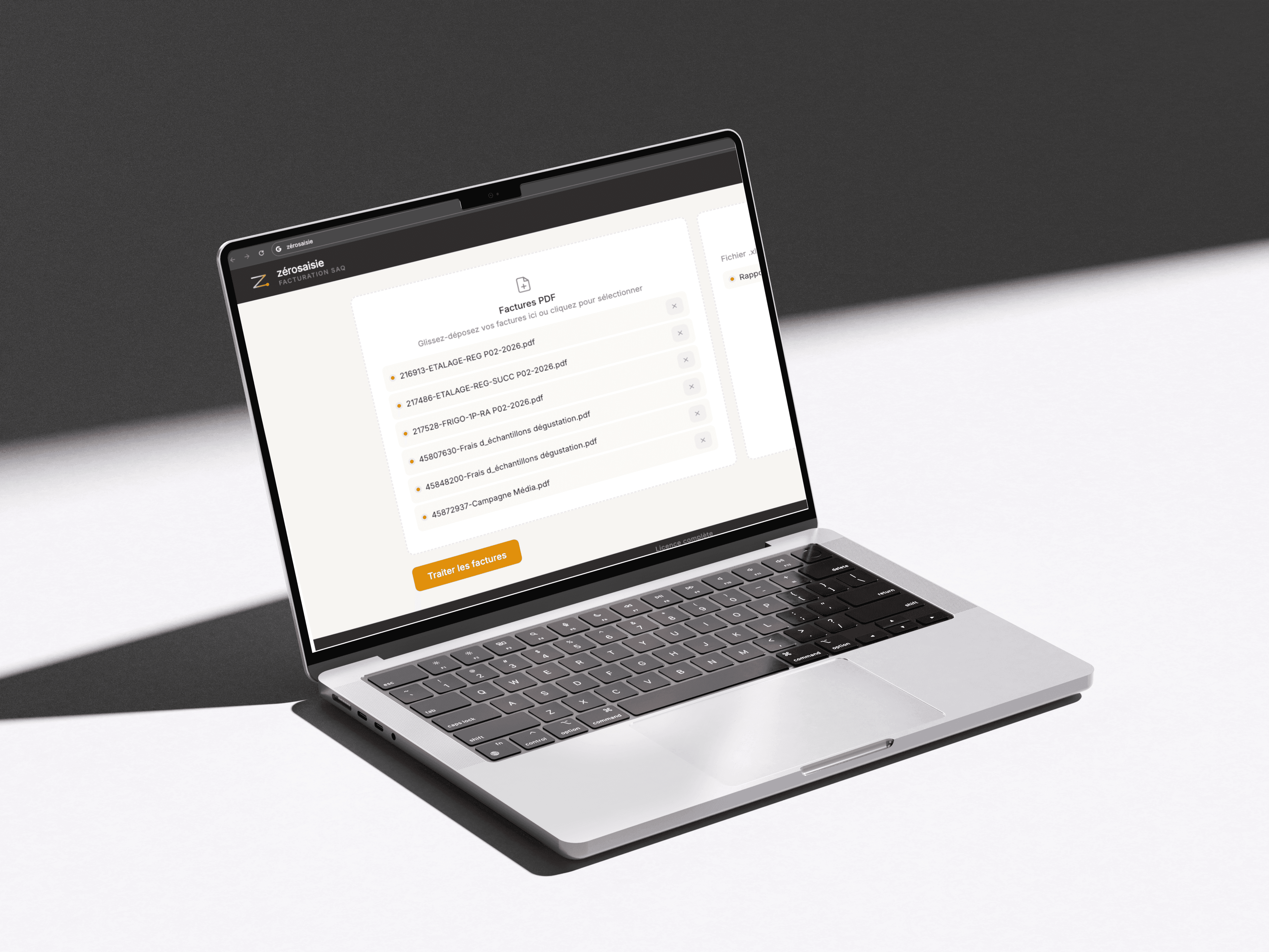 The ZéroSaisie invoice processor showing extracted SAQ invoice data reconciled line by line